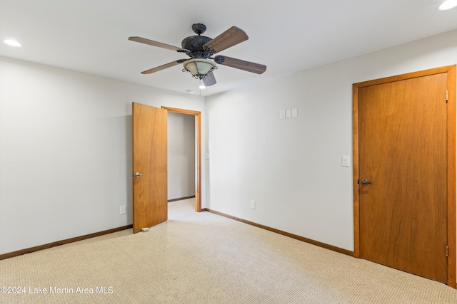 unfurnished room with light carpet, recessed lighting, baseboards, and ceiling fan