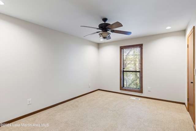 carpeted spare room with recessed lighting, baseboards, visible vents, and ceiling fan