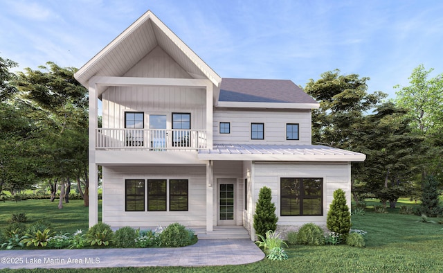 view of front of property with a front lawn, a balcony, and metal roof