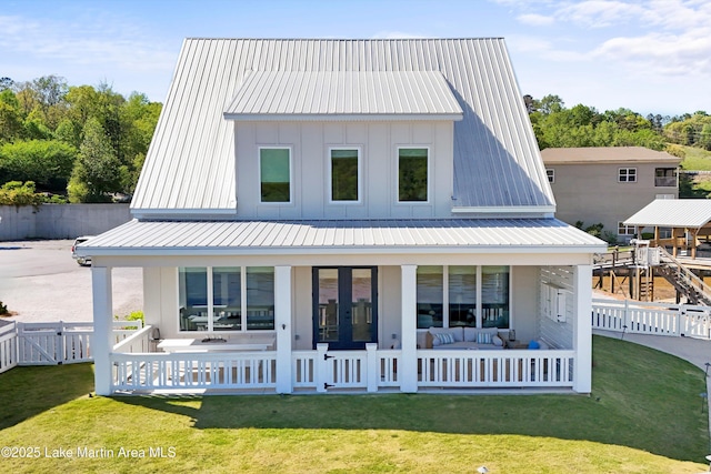 302 Williams Rd, Alexander City, AL 35010 - back of property featuring a porch, a yard, metal roof, and fence private yard