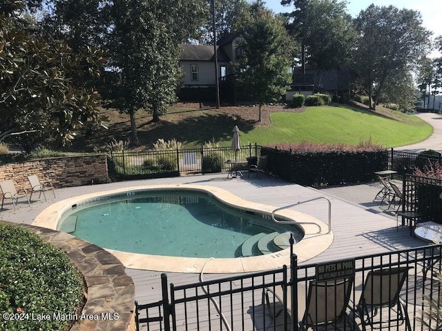 view of swimming pool with a patio