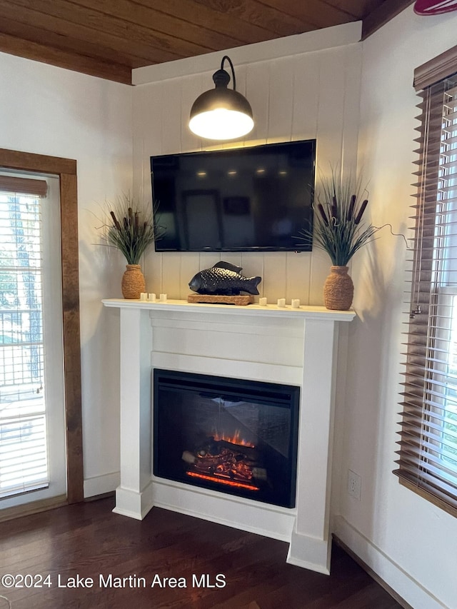 interior details with hardwood / wood-style flooring and wood ceiling