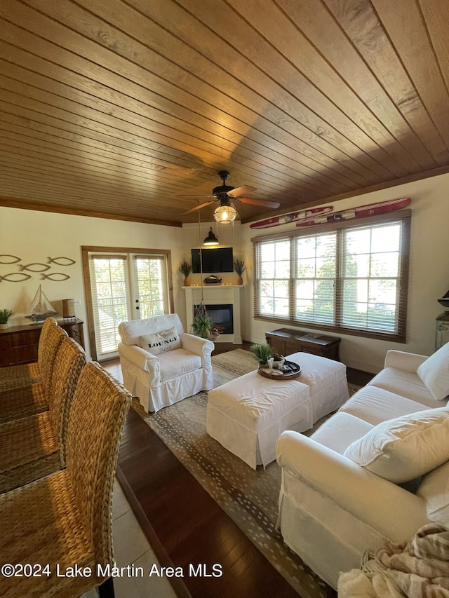 living room with wood ceiling and a healthy amount of sunlight