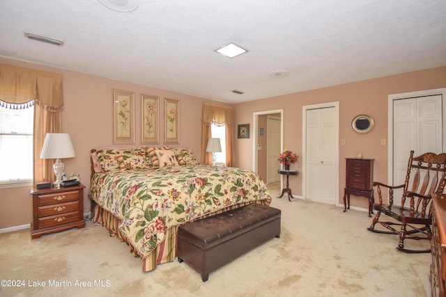 bedroom featuring carpet floors and a textured ceiling