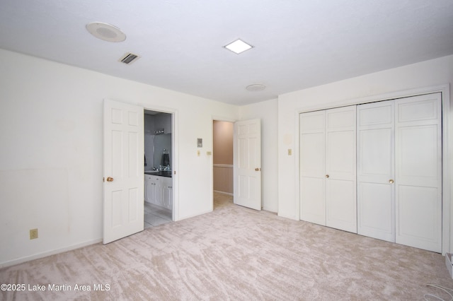 2130 Skylark Dr, Alexander City, AL 35010 - unfurnished bedroom featuring carpet, a closet, baseboards, and ensuite bathroom