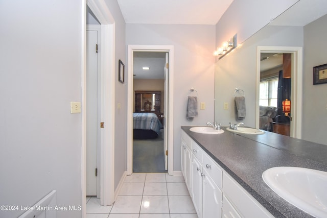 bathroom featuring tile patterned flooring and vanity