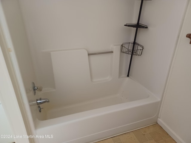 bathroom featuring tile patterned floors and shower / tub combination