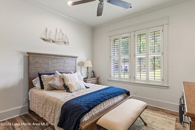 bedroom with ceiling fan, dark hardwood / wood-style flooring, and ornamental molding