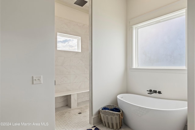 bathroom featuring tile patterned floors and independent shower and bath