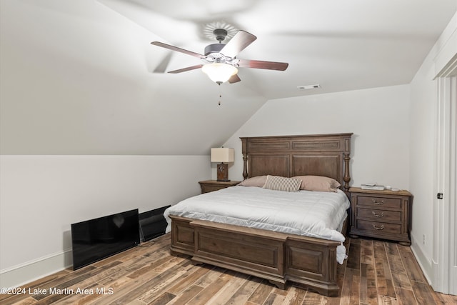 bedroom featuring hardwood / wood-style floors, ceiling fan, and lofted ceiling