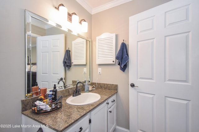 bathroom with vanity and ornamental molding