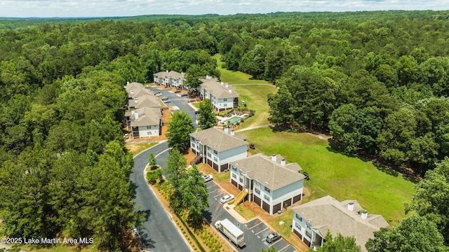 drone / aerial view with a view of trees