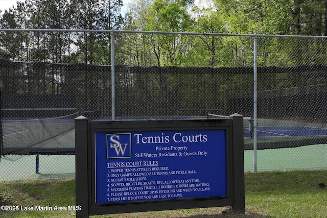 view of tennis court with fence