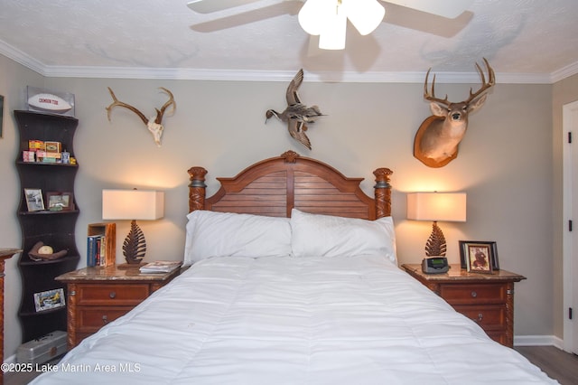 bedroom featuring crown molding, baseboards, ceiling fan, and wood finished floors