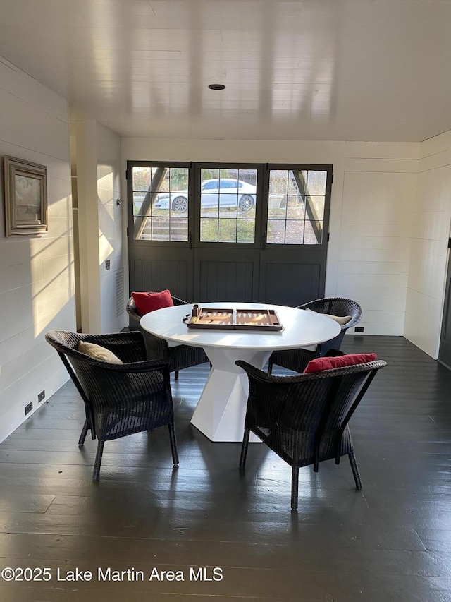 dining area featuring dark hardwood / wood-style flooring, a wealth of natural light, and breakfast area