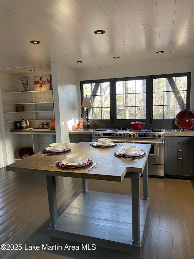 kitchen with gray cabinets, wooden ceiling, dark hardwood / wood-style floors, and high end stainless steel range oven