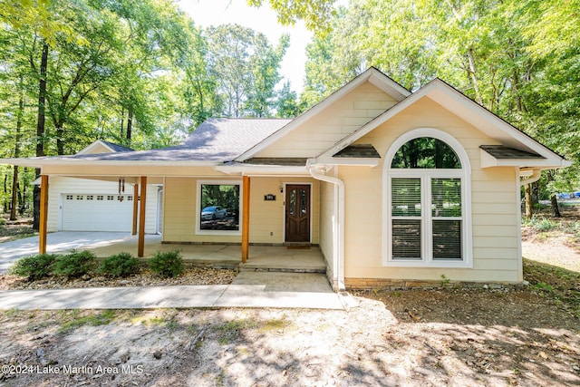 view of front of house featuring a porch and a garage