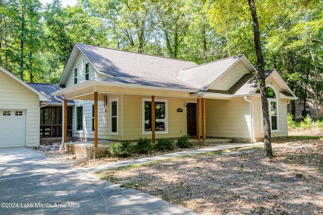 view of front of property featuring a garage and covered porch