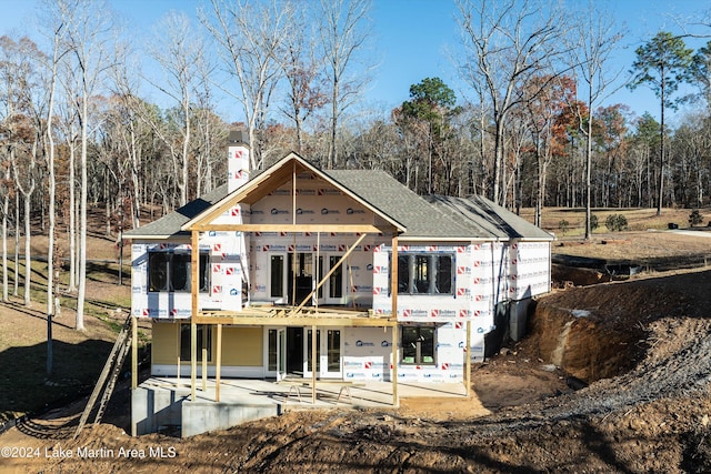 back of property with a patio