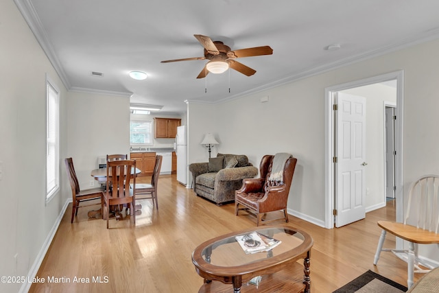 72 Christopher Cir, Alexander City, AL 35010 - living room with light wood-style floors, a ceiling fan, and ornamental molding