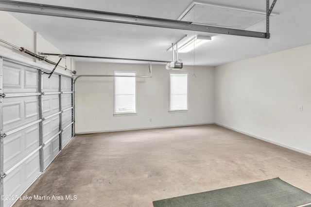 72 Christopher Cir, Alexander City, AL 35010 - garage with a garage door opener and baseboards