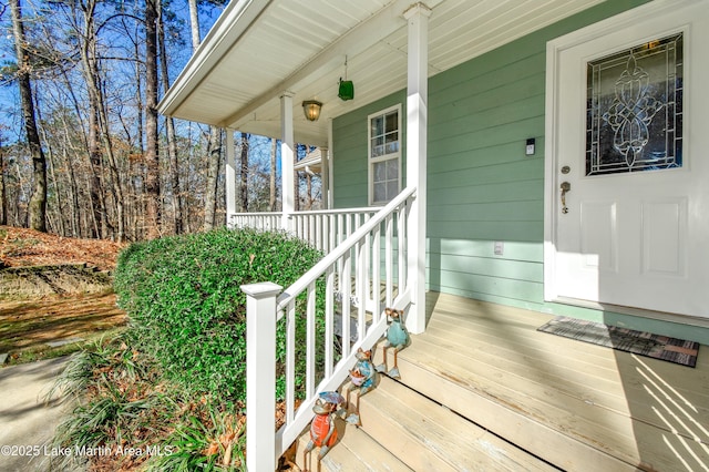 view of exterior entry with a porch