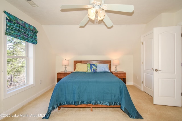 bedroom featuring lofted ceiling, carpet flooring, baseboards, and visible vents