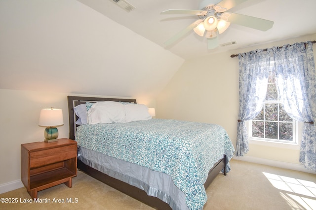 carpeted bedroom featuring lofted ceiling, a ceiling fan, visible vents, and baseboards