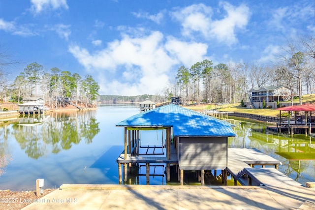 dock area with a water view and boat lift