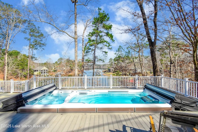 view of pool featuring a covered hot tub and a wooden deck