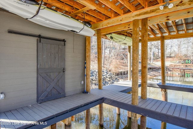 wooden deck featuring a boat dock