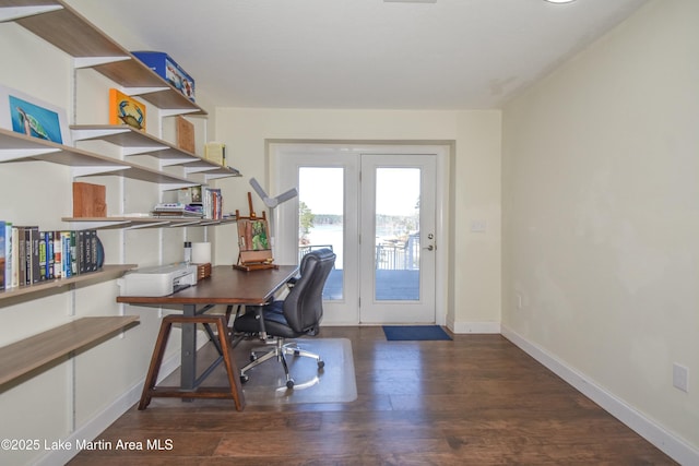 office space with baseboards and wood finished floors