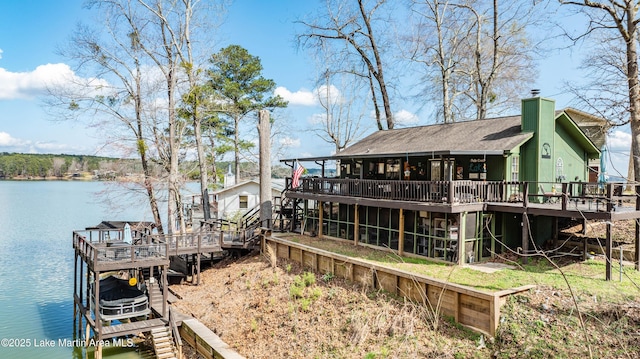 view of dock with a deck with water view