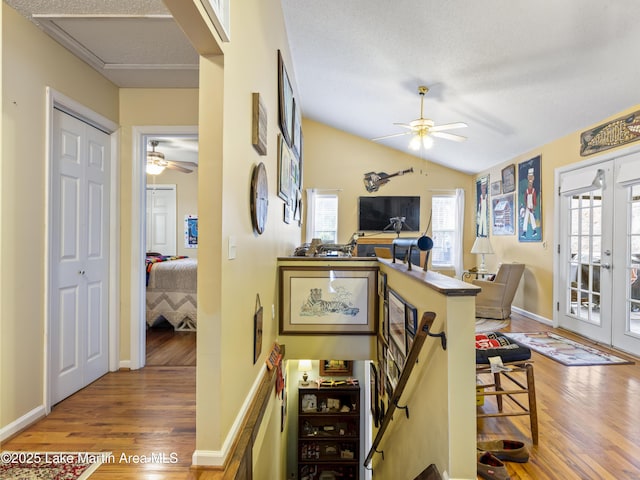 dining area with vaulted ceiling, wood finished floors, and ceiling fan