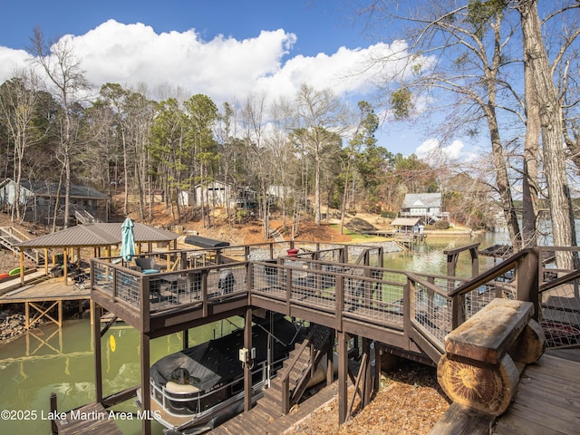 dock area featuring a deck with water view