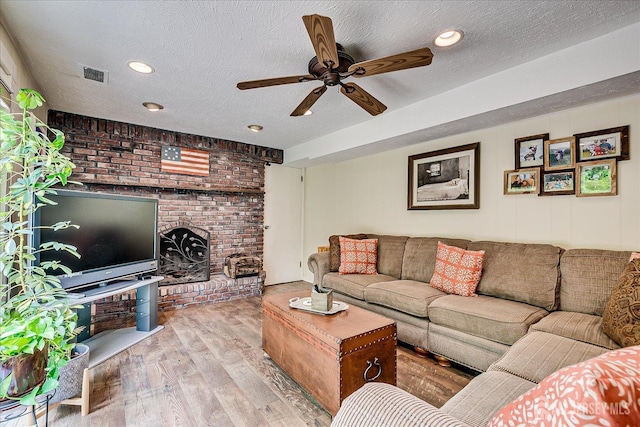 6 Zaydee Dr, Edison, NJ 08837 - living area with ceiling fan, wood finished floors, a textured ceiling, a brick fireplace, and recessed lighting