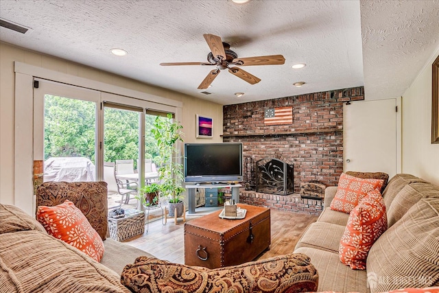 6 Zaydee Dr, Edison, NJ 08837 - living area featuring a ceiling fan, a textured ceiling, wood finished floors, a fireplace, and recessed lighting