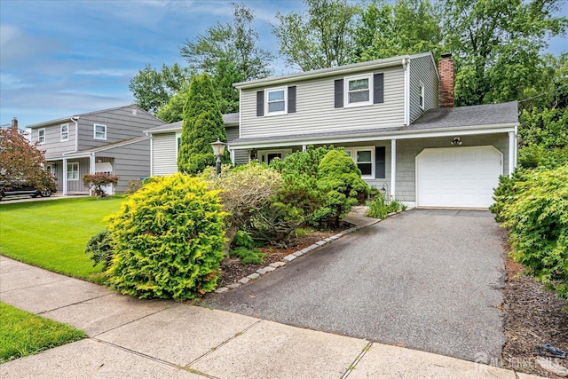 6 Zaydee Dr, Edison, NJ 08837 - traditional home with an attached garage, a chimney, driveway, and a front yard