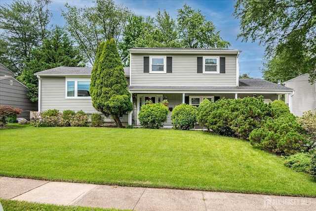 6 Zaydee Dr, Edison, NJ 08837 - traditional-style house with a front yard and a porch