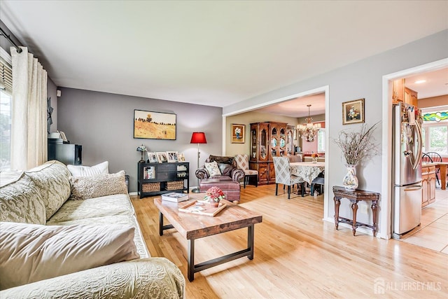 6 Zaydee Dr, Edison, NJ 08837 - living area featuring a chandelier and light wood finished floors