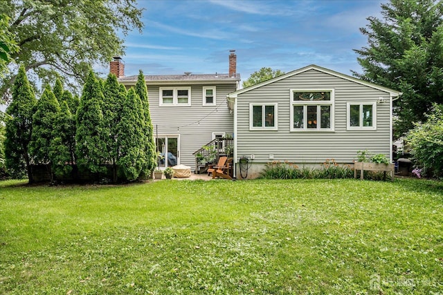 6 Zaydee Dr, Edison, NJ 08837 - back of property with a yard and a chimney