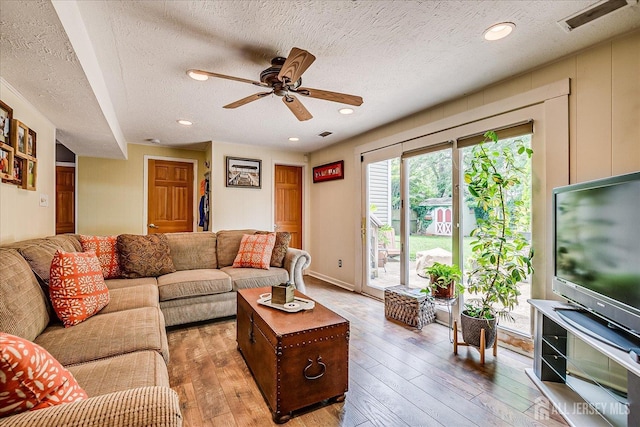 6 Zaydee Dr, Edison, NJ 08837 - living room with ceiling fan, light wood finished floors, and a textured ceiling