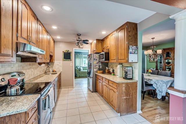 6 Zaydee Dr, Edison, NJ 08837 - kitchen with stainless steel appliances, ventilation hood, a chandelier, decorative backsplash, and recessed lighting