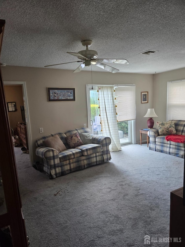 146 Old Nassau Rd, Monroe, NJ 08831 - living area with carpet flooring, a ceiling fan, and a textured ceiling