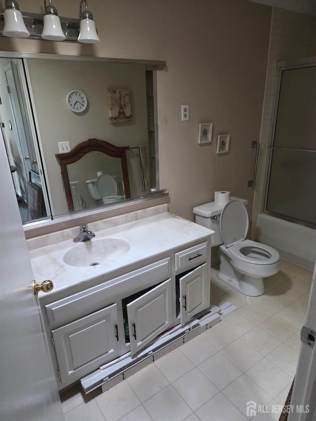 146 Old Nassau Rd, Monroe, NJ 08831 - full bath featuring vanity, toilet, shower / bath combination with glass door, and tile patterned flooring