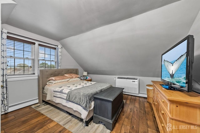 bedroom featuring vaulted ceiling, hardwood / wood-style floors, and a baseboard radiator