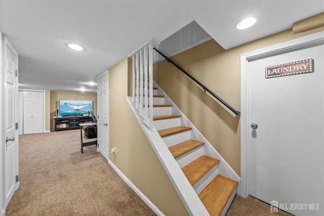 staircase with carpet and baseboards