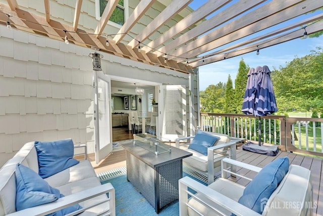 wooden terrace with a pergola and an outdoor hangout area