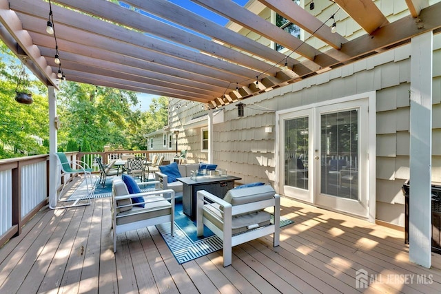 deck with a pergola and an outdoor hangout area