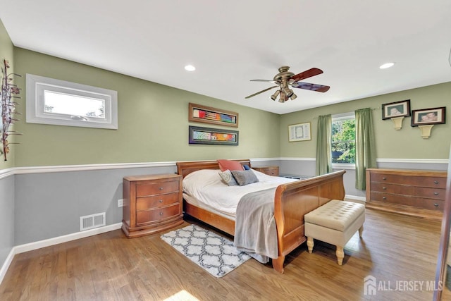 bedroom featuring light wood-type flooring and ceiling fan